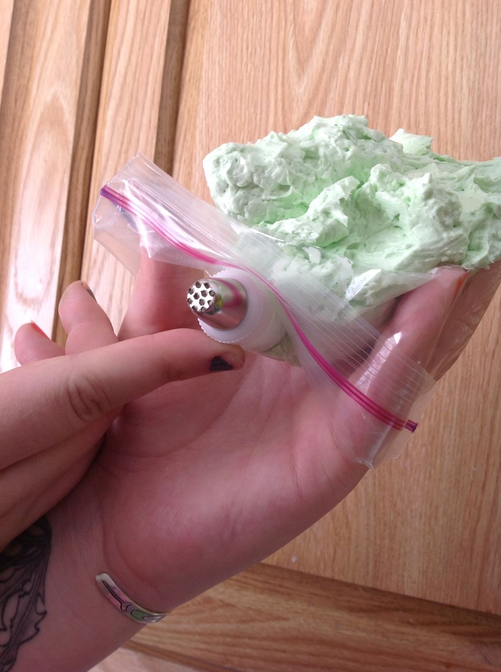 Use a grass tip for piping, or a star tip if you do not have a grass tip