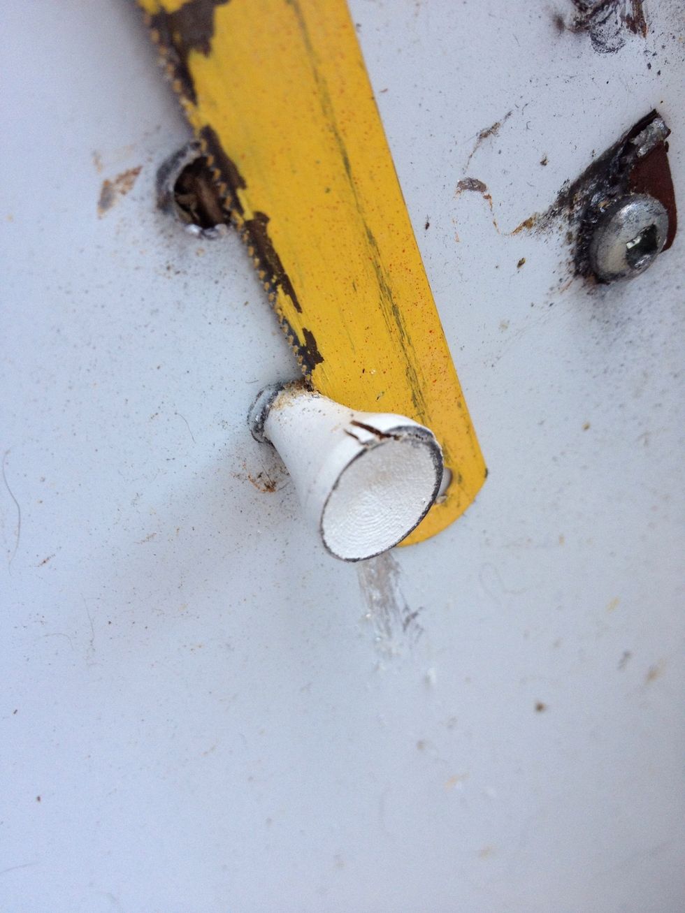 Use a hacksaw blade to trim off the excess. Or, alternatively, a swift side-swipe with the hammer should give you a clean enough break.