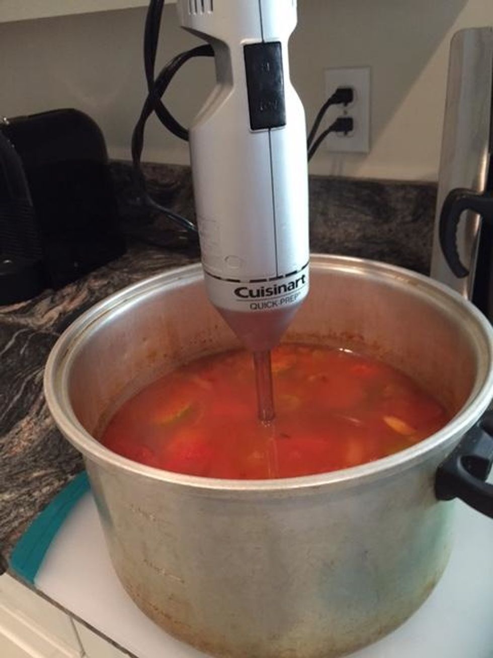 Use a hand blender to blend the soup until it is smooth. Adjust spices.Return the soup to simmer on a low heat.