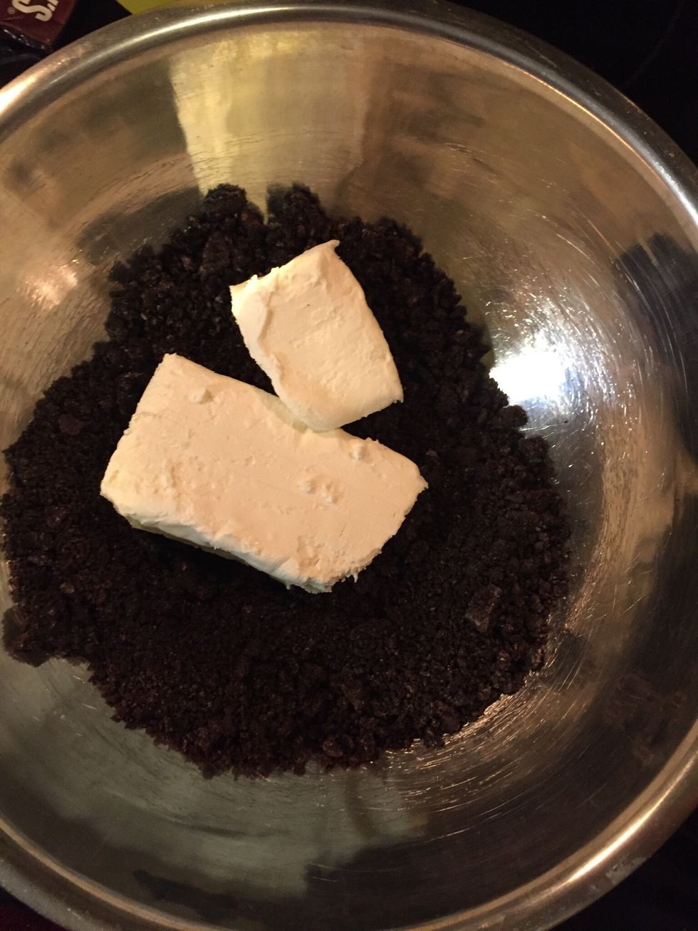 Use a hang mixer and add in the cream cheese at a low power