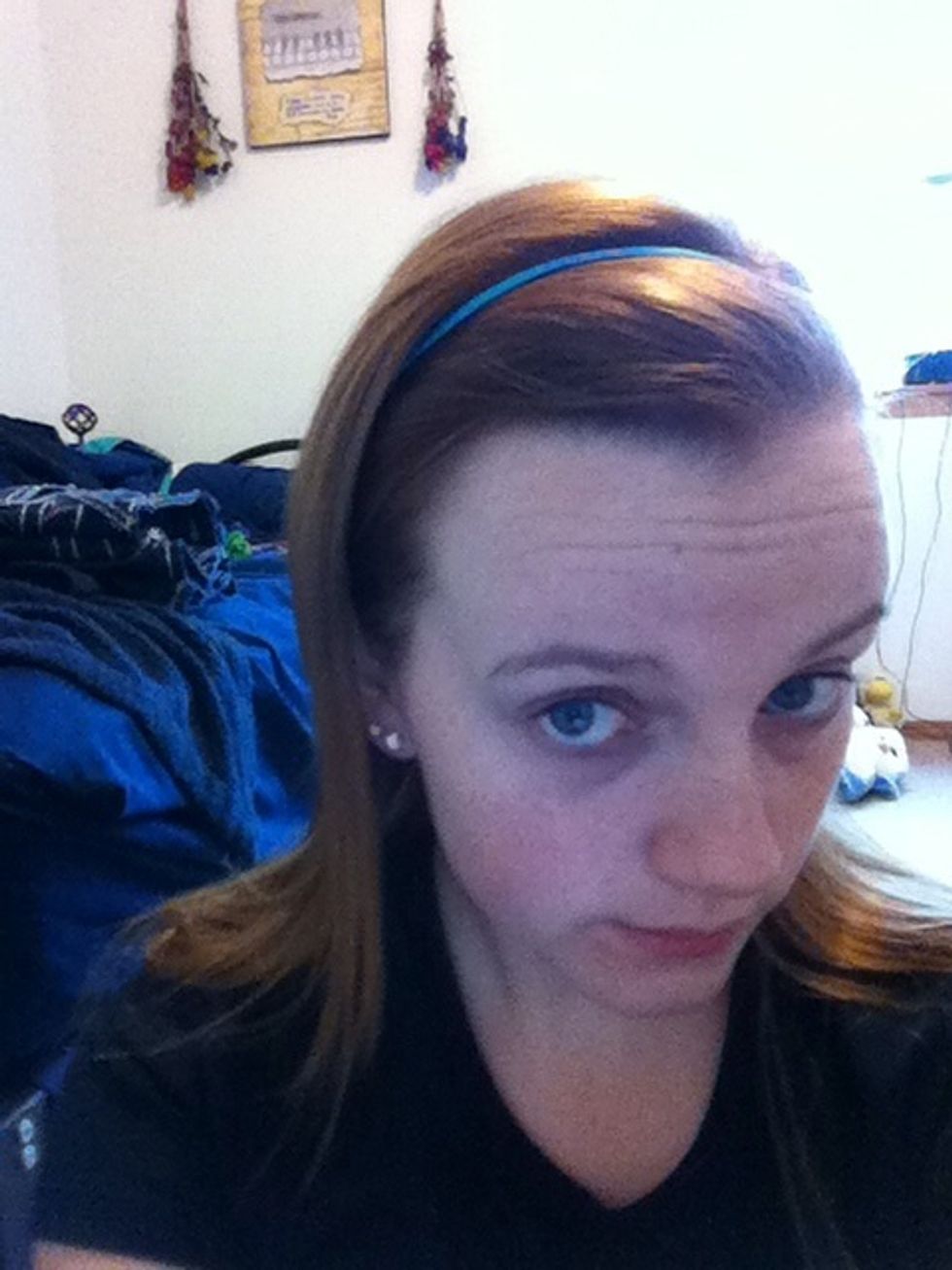 Use a headband to pull your hair back from your face, making sure to get all loose strands.