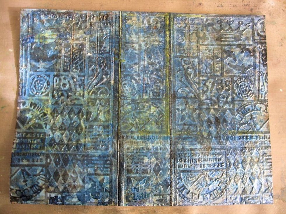 Use a heat tool to melt the embossing powder, starting on the underside of the surface and moving to the top once the powder starts to melt.