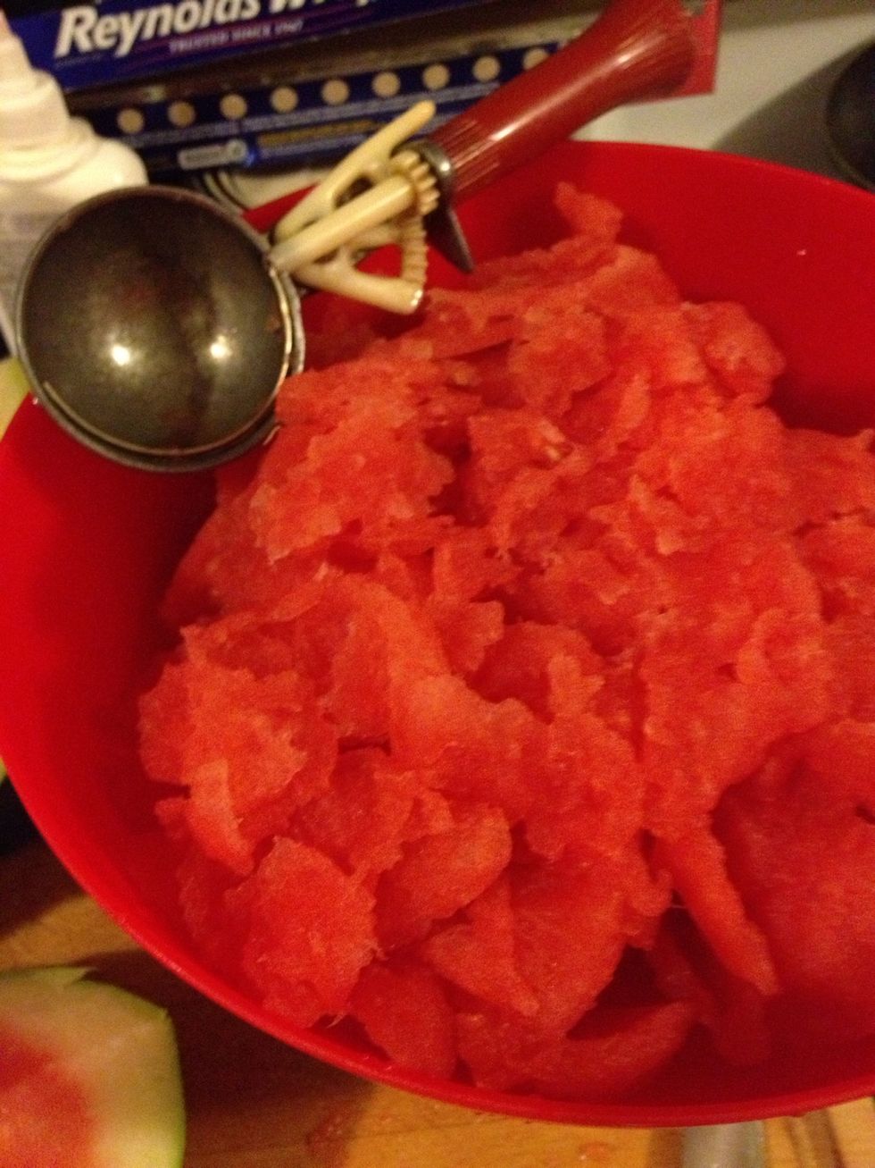 Use a ice cream scope dip out half of the water melon.