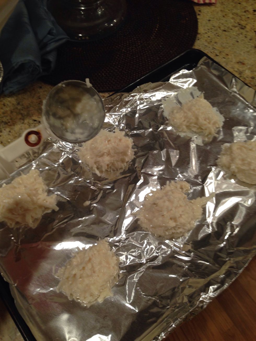 use a icecream scoops to use the size for the cookies and place them on a cookie sheet (don't forget to use nonstick or Pam)