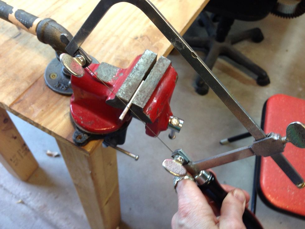 Use a jewelry saw to cut your tubing into short pieces. You will need one at each point where 2 leather pieces meet. I used 9 pieces. They varied in length from 3/8" to 5/8" long.