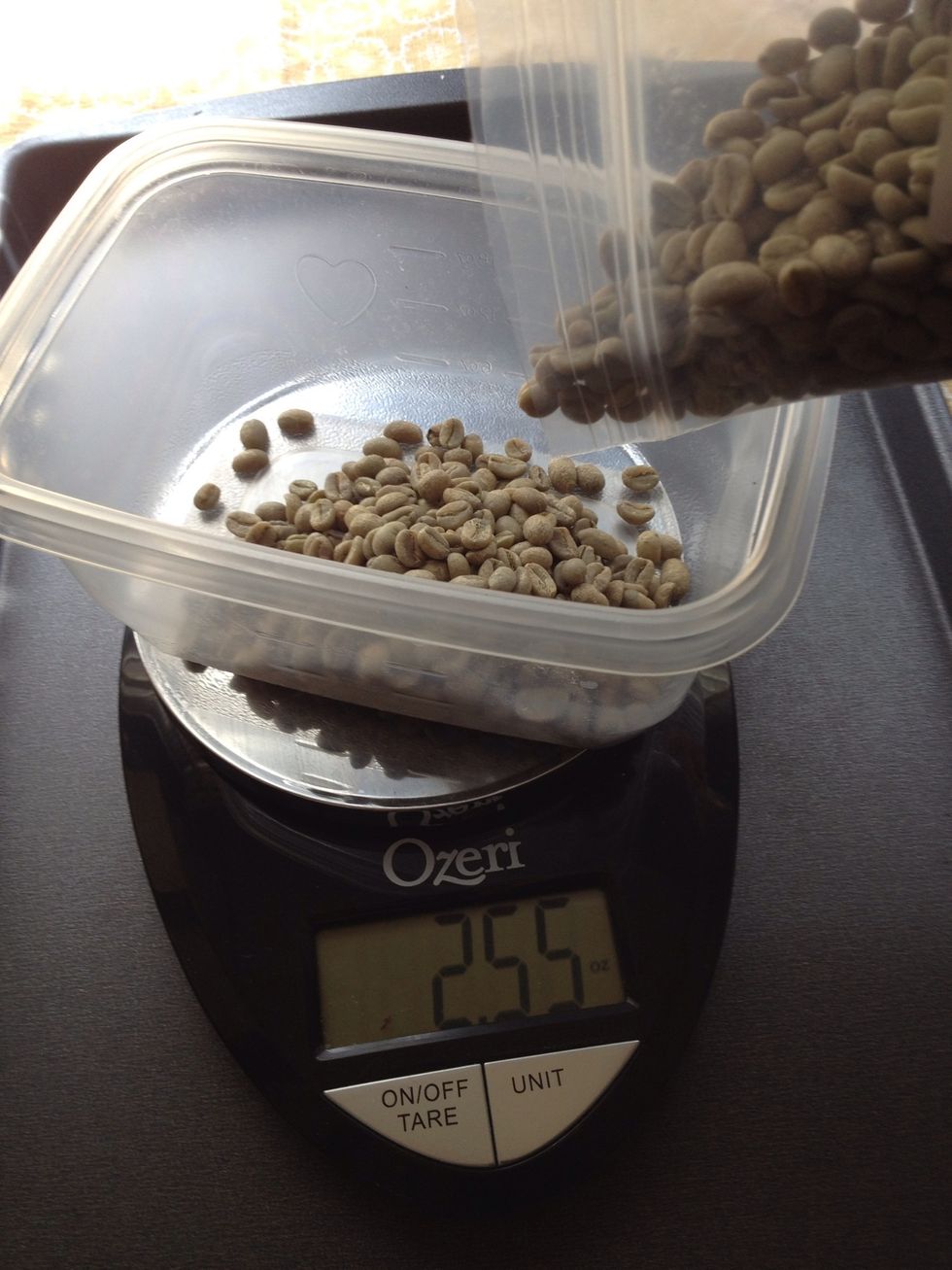 Use a kitchen scale to measure 8 ounces of green beans. Place them in a bowl or small container near the stove or burner where you will be roasting your beans.