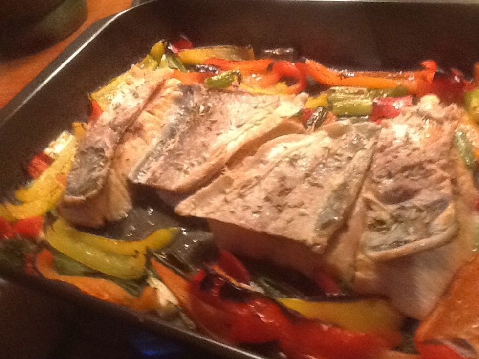 Use a knife and your fingers to remove the skin. Flip the skin and add salt and fennel seeds to it. Put the tray back in the oven for 5 minutes.