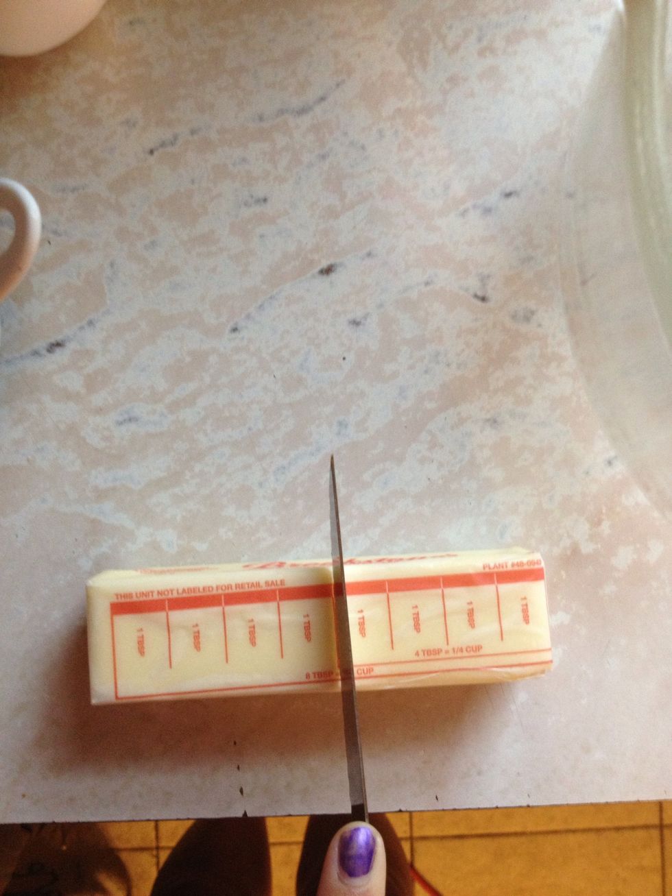 Use a knife to cut 4tbsp of butter and set it aside.