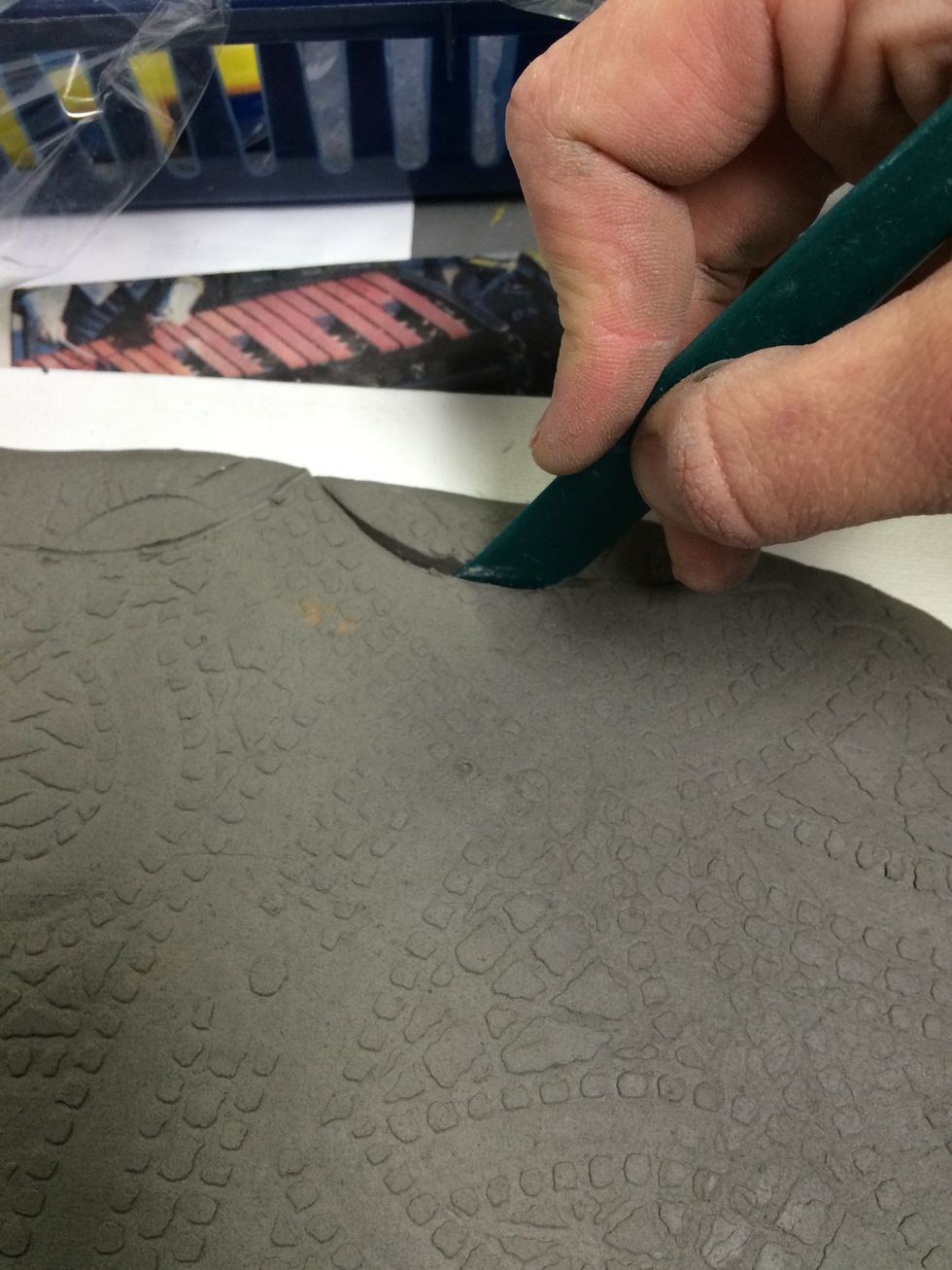 Use a knife tool to carve out the shape.