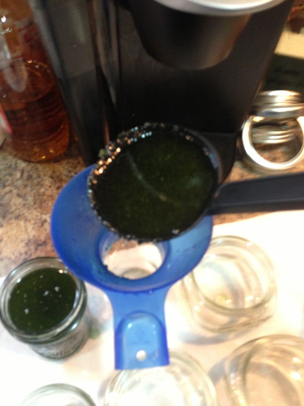 Use a ladle and your jar funnel and fill them to within 1/4 inch of the rim of the jar.