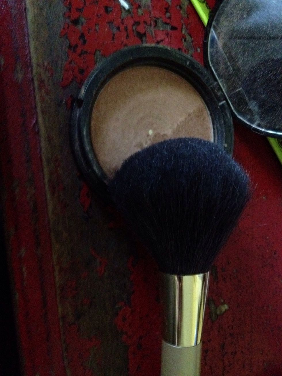 Use a large kabuki brush