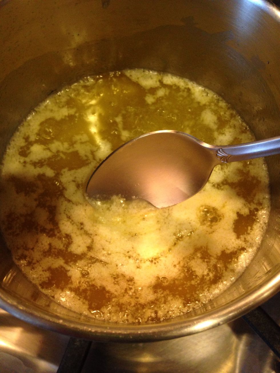 Use a large spoon or sieve to remove impurities that have risen to the top.