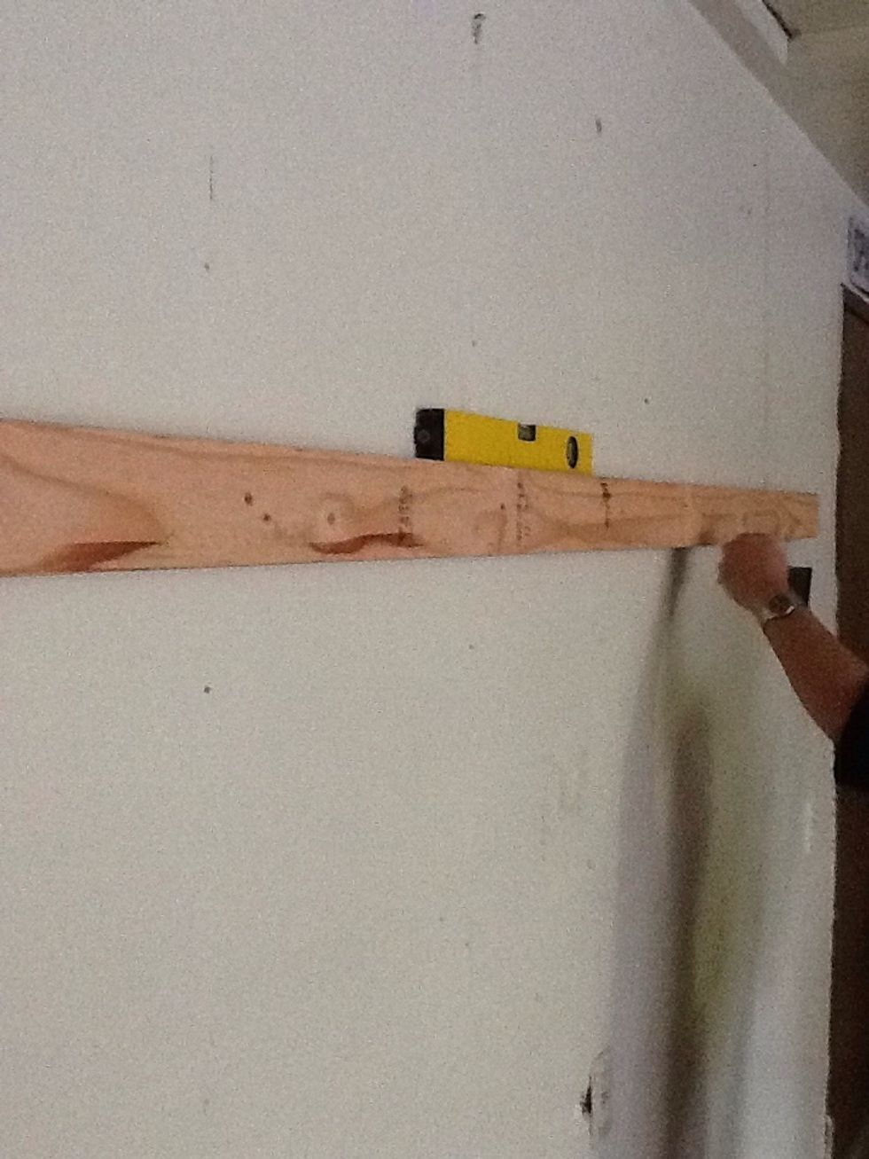 Use a level and a stud finder to make sure your shelves are straight and sturdy.