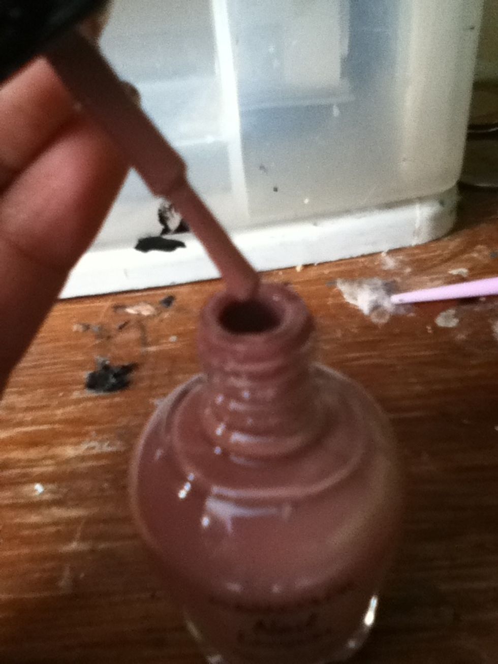 Use a light brown nail polish with the tip of the brush make some spot in your nails