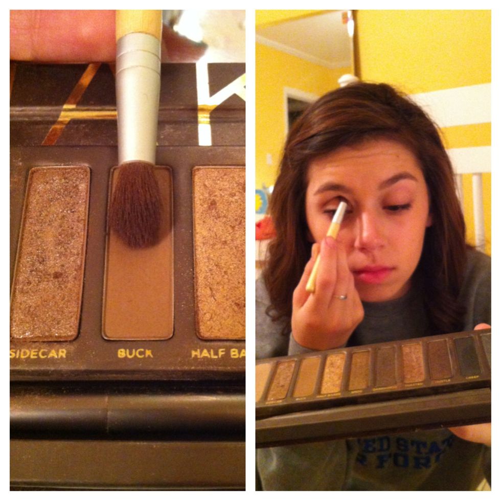 Use a medium matte brown shade in your crease, by sweeping the brush in a windshield wiper motion into the hollow of your eye.