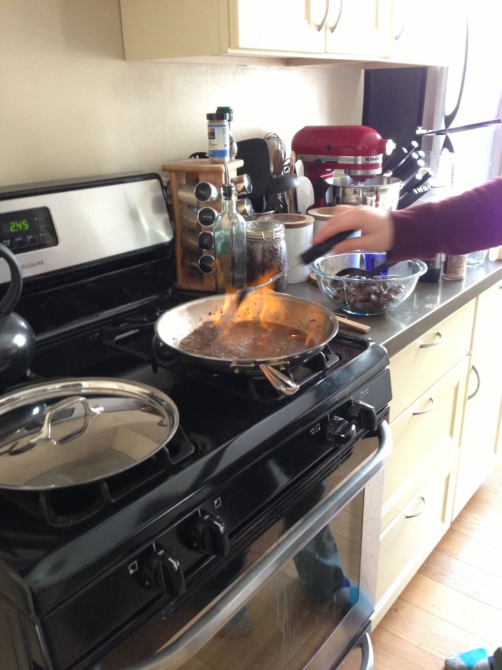 Use a *metal* spoon to stir, and let it burn and cook down until most of the liquid has evaporated. Let it cool off.