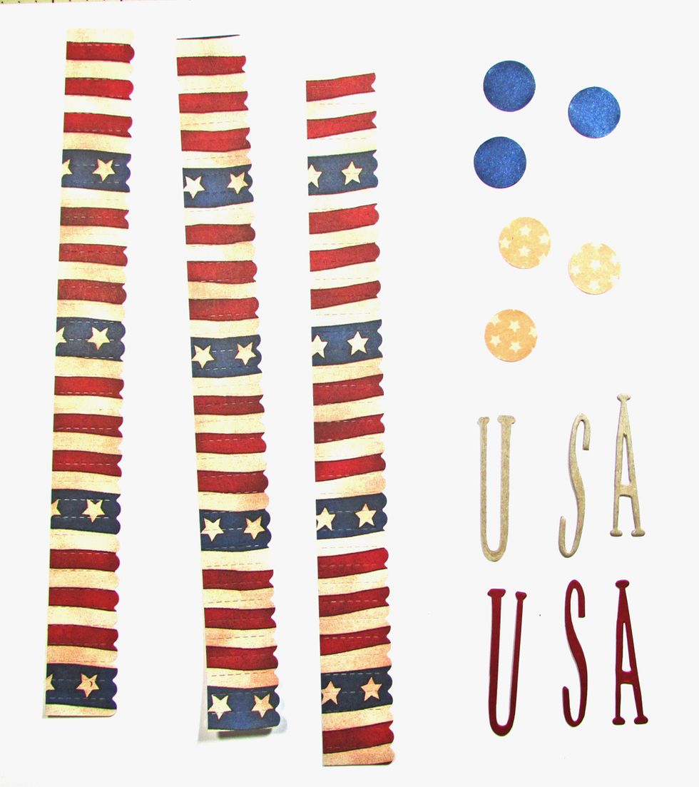 Use a Mini Rosette die to cut three strips of patriotic paper. Cut six, 3/4" circles from kraft and blue cardstock. Cut "USA" from chipboard and again from red cardstock.