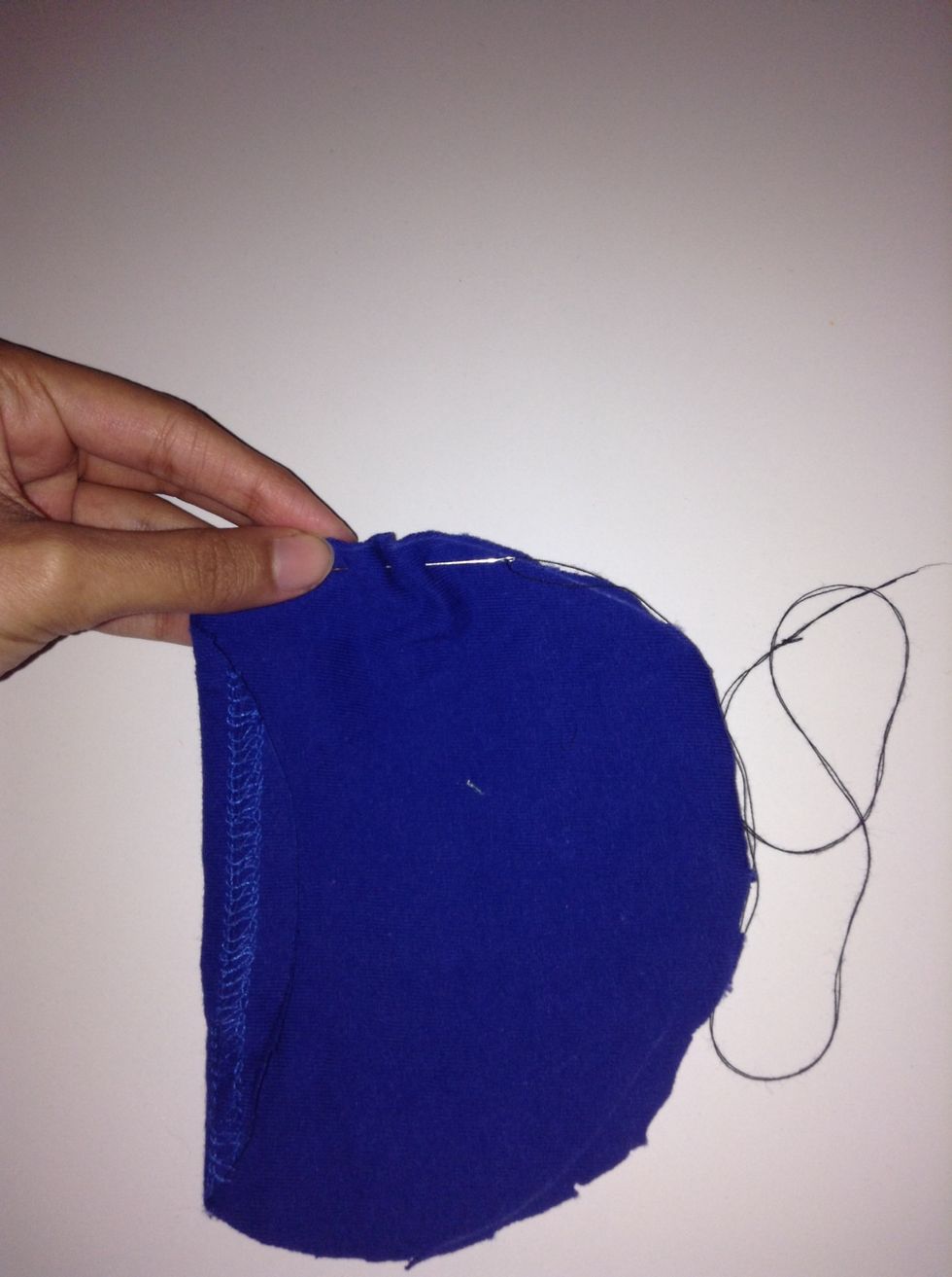 Use a needle & thread to stitch through the edge in one line all the way to the other side.