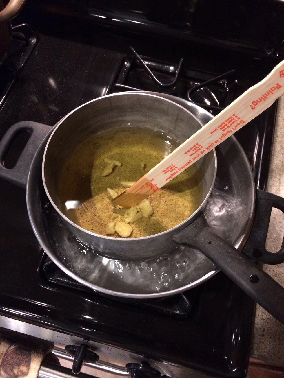 Use a paint stick to stir wax and speed up melting process. I choose to melt one bag at a time so I could better manage pouring my wax.