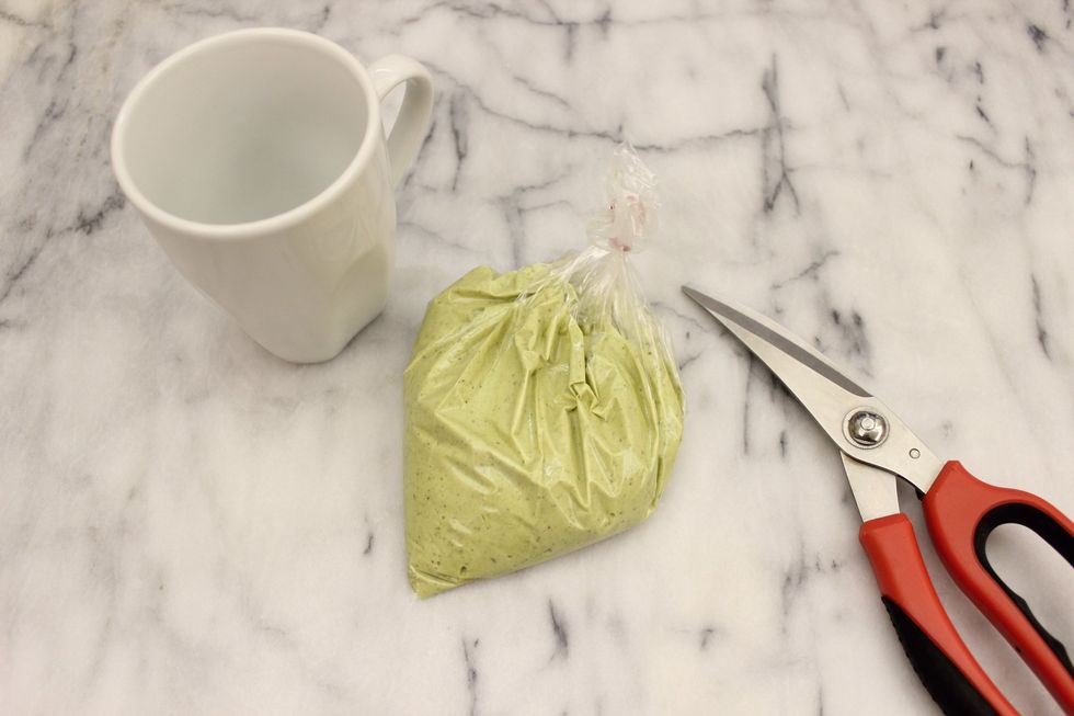 Use a pair of scissors to snip off a tiny corner of the sandwich bag.