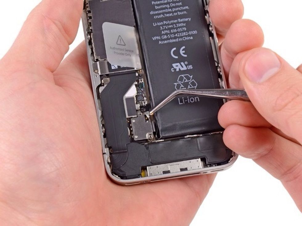 Use a pair of tweezers to remove the pressure contact near the battery connector. When reinstalling the pressure contact, be sure to clean it. The oils on your fingers can create wireless interference
