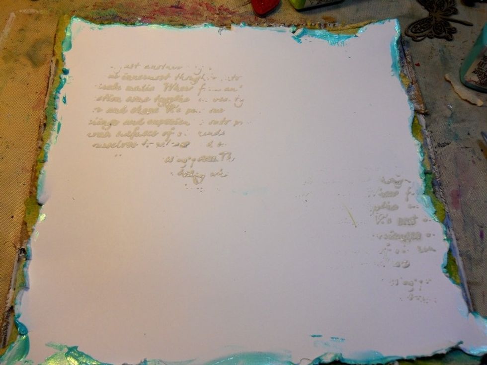 Use a palette knife to spread Texture paste through a stencil.