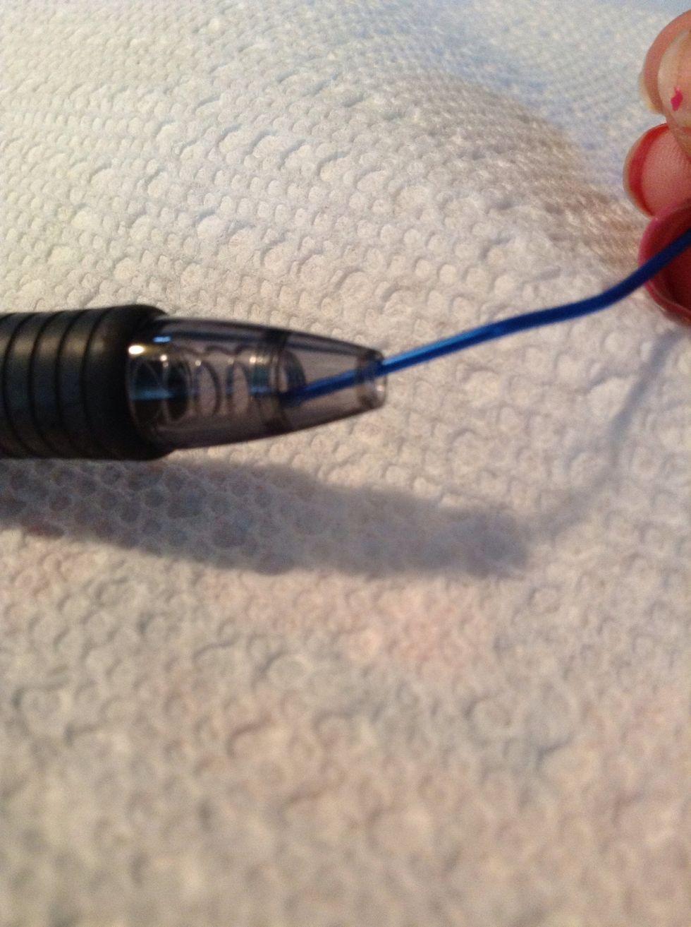 Use a paper clip to push out the spring