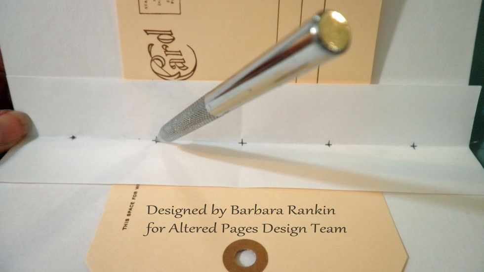 Use a paper piercer or awl to pierce the signature pages, all at once. Keep the signatures folded up in a "V" shape while piercing to ensure piercing on the fold line of each page.