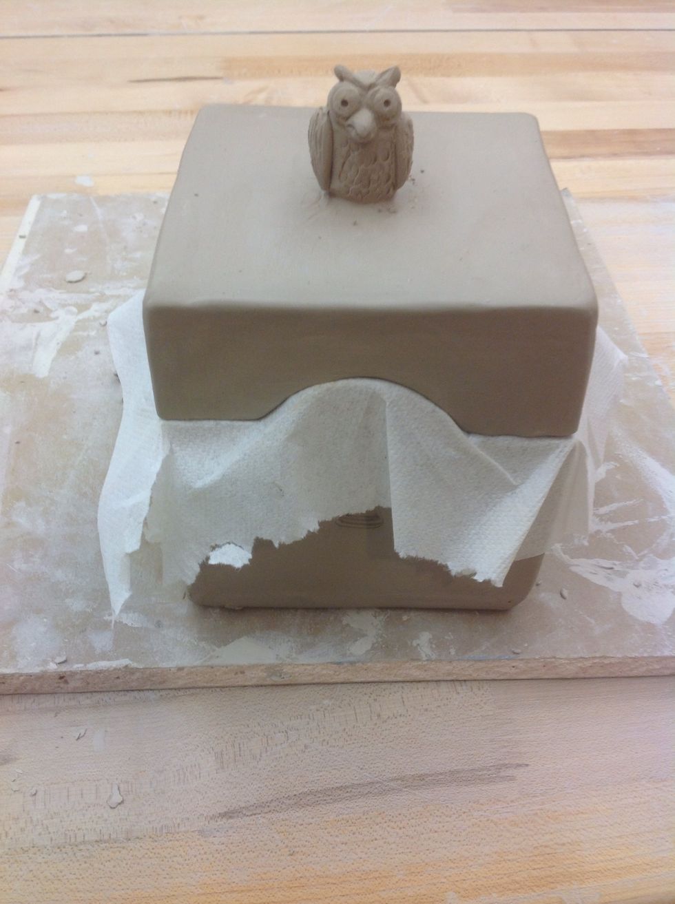 Use a paper towel to keep the lid from sticking to the box as it dries.