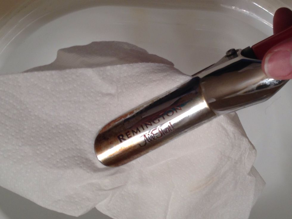 Use a paper towel to wipe off the access waxs