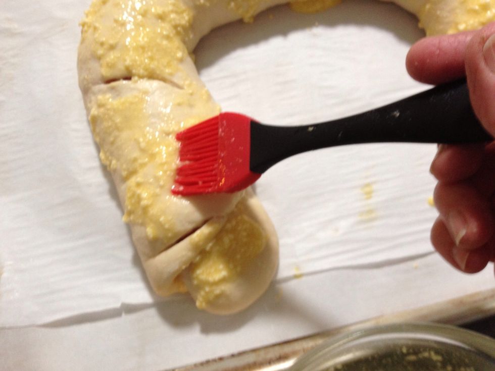 Use a pastry brush to spread the egg mixture on the loaf!