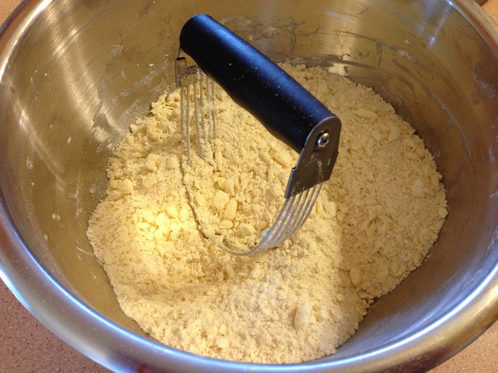 Use a pastry fork to blend these together. It should begin to clump loosely all together in a big ball when you have enough margarine cut in (even more than this photo). Don't skimp on margarine.
