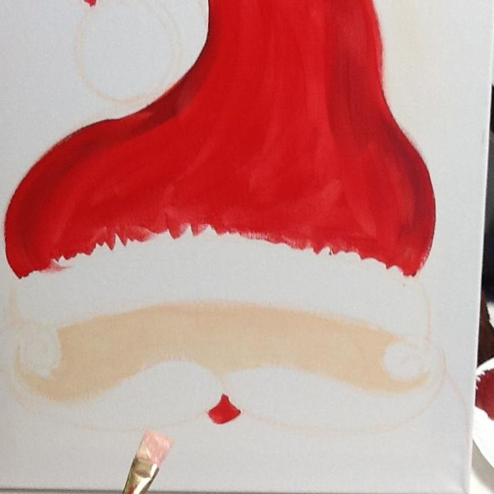 Use a peachy color to paint his face.