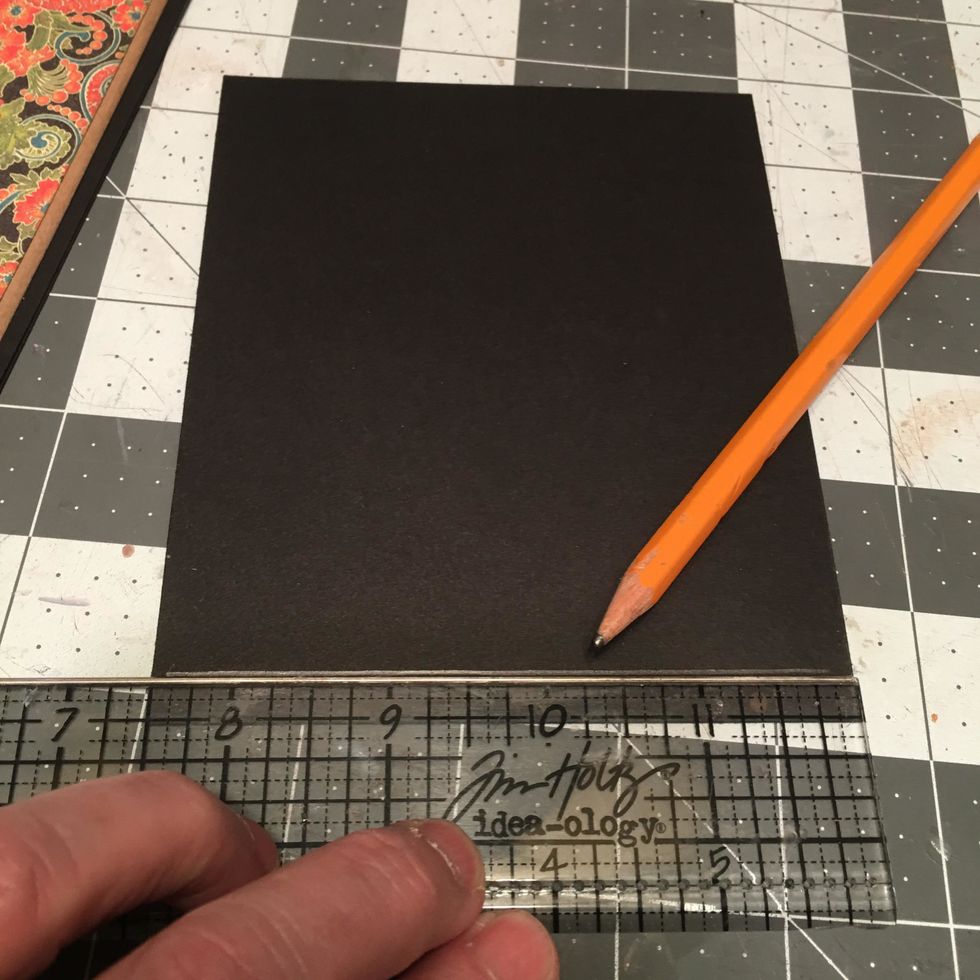 Use a pencil & ruler to draw a 1/4" placement line on the back bottom edge of each cover piece.