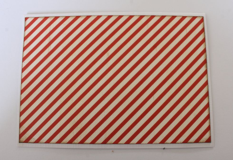 Use a piece of linen cardstock of 5.9 x 7.9" and fold it in the middle. Cut out a rectangle of 5.7x3.6" from the "R&R" paper and attach it onto the cardstock card base.