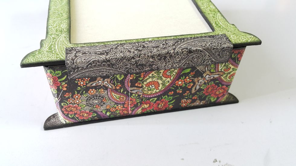 Use a piece of scraps to hold the front window in place