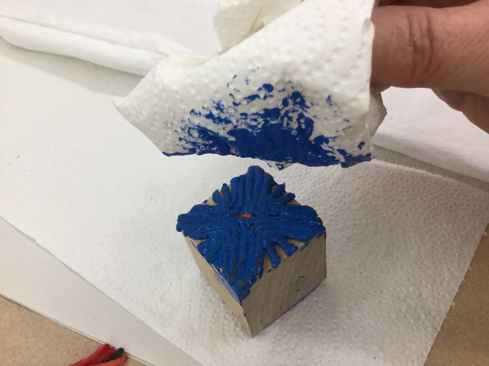 Use a piece of sponge or paper towel to tap paint onto your design.