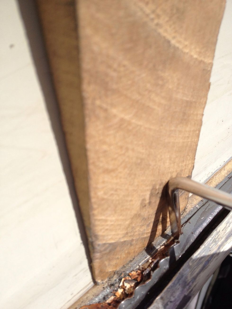 Use a piece of wood to keep your roof clear of damage and give your screwdriver some more leverage when you go inch by inch around the car.