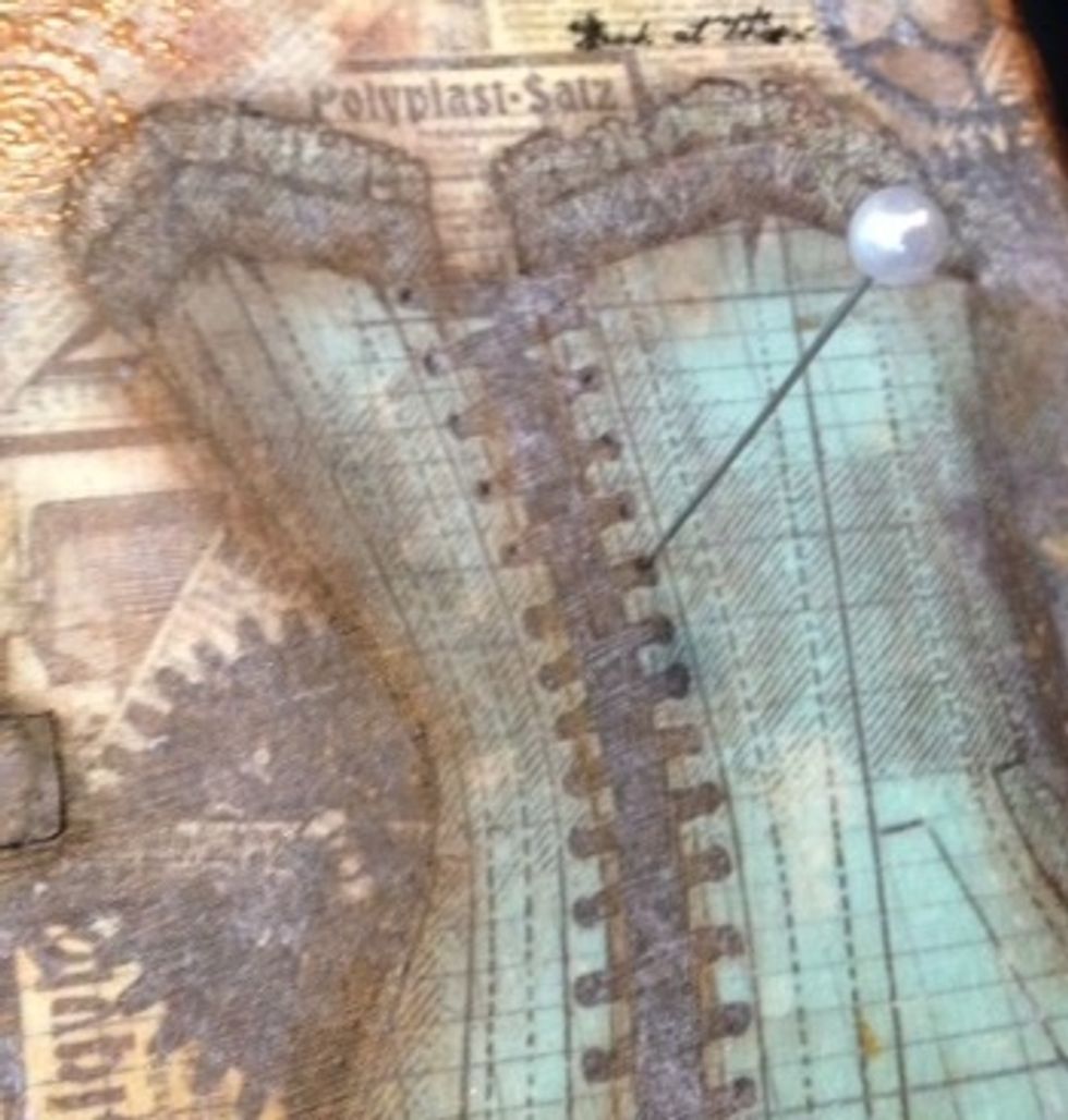 use a pin to poke holes into the canvas to feed the ribbon through