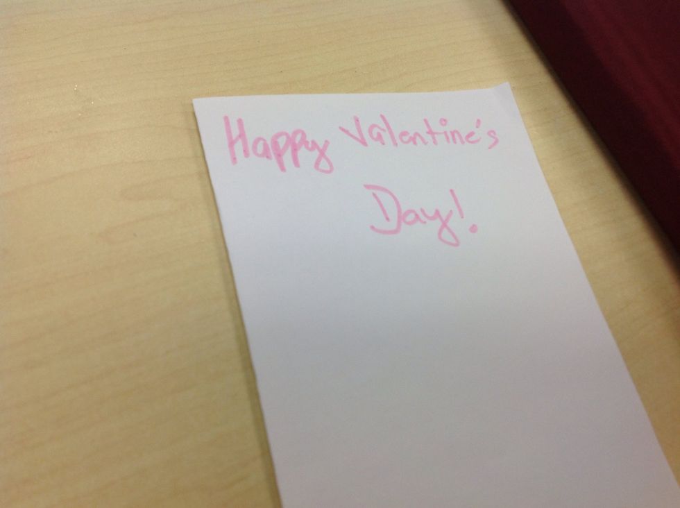 Use a pink marker to write" happy valentine's day".