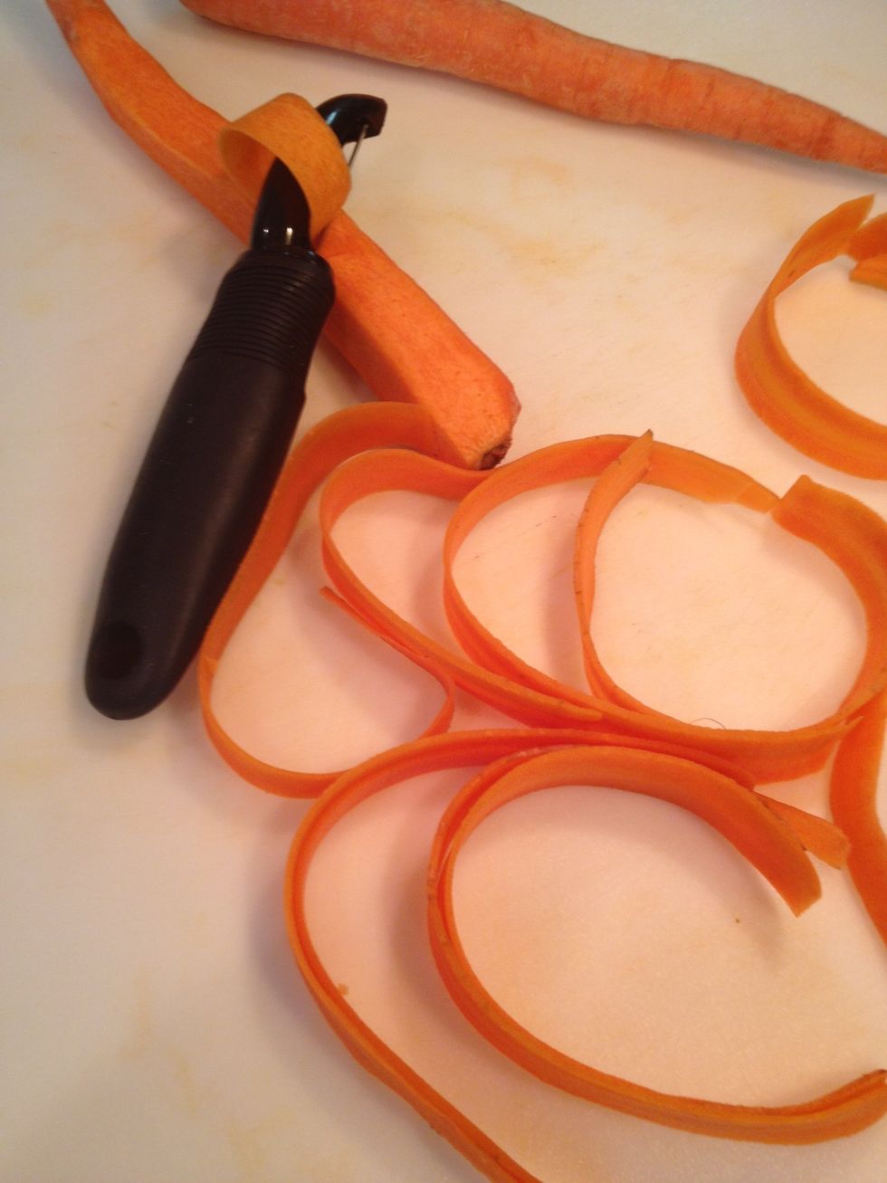 Use a potato peeler and make thin strips of carrots