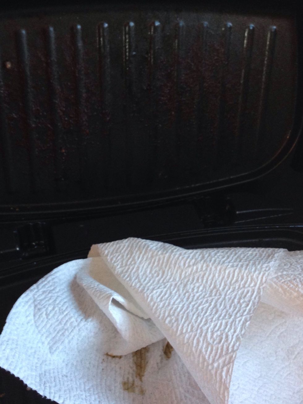 Use a rag or paper towel to wrap off the burnt sticky pieces.