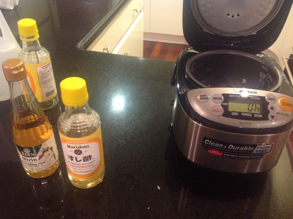 Use a rice cooker to cook 1 cup sushi rice ( short grain rice ).