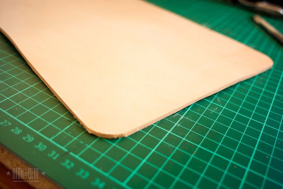 Use a round cap (or anything with a good radius that you can find around the house) to mark where you have to cut the corners. You have to cut all 4 corners and try to make them as even as possible.