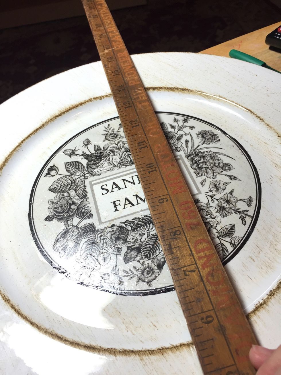 use a ruler to line up and mark placement of medallions.