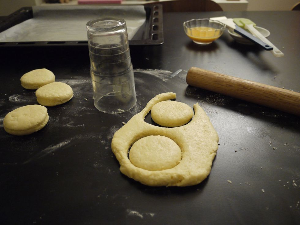 Use a scone cutter, or just using a drinking glass, cut the dough and place them on the greased baking tray.   Graze the tops with beaten egg and bake for 15-20 minutes until lightly golden.