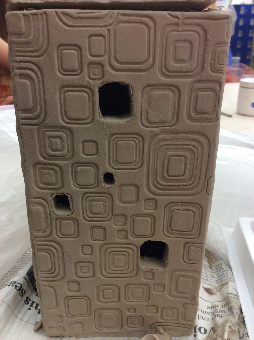 Use a sharp knife to cut openings in the sides and lid of the lantern. Make sure to leave at least 1/2" uncut around the corners to maintain the structural integrity of the lantern.