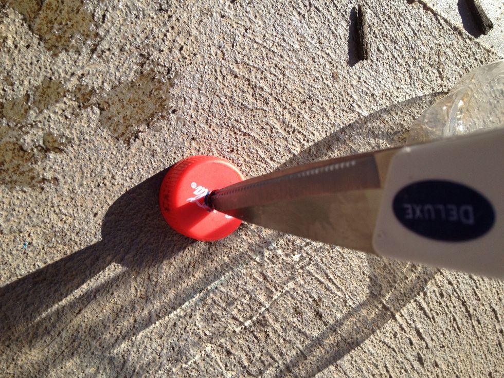 Use a sharp tool to make the hole where u just marked