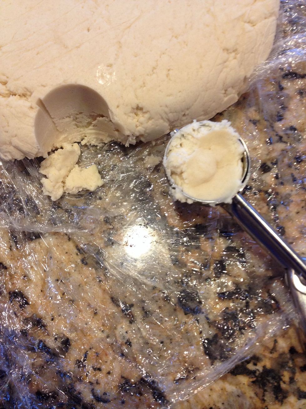 Use a small scooper and dig into the cold dough and get a little bit over sized scoop