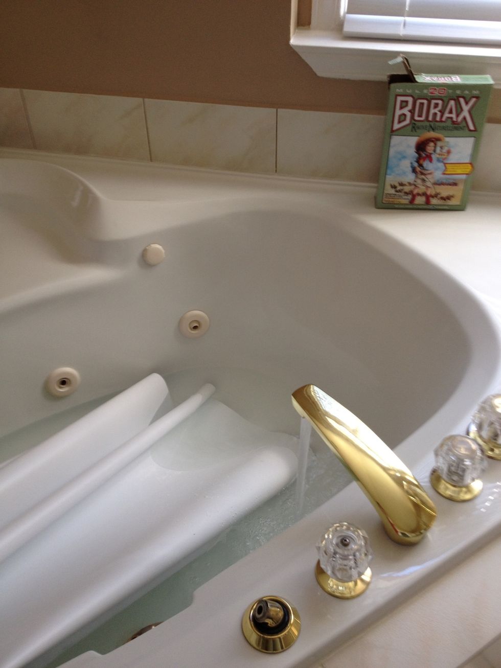 Use a solution of 1/4 c of Borax to 1 gallon of warm water and put it in the bath.